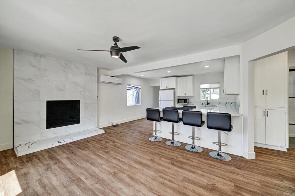 Fireplace, Interior, Kitchen, Marble Walls, Recessed Lighting, Wood Texture Flooring