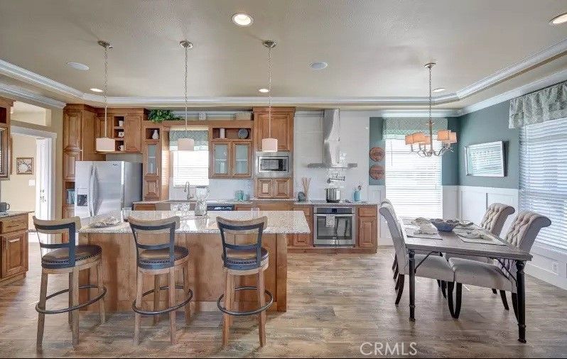 Chandelier, Dining room, Interior, Kitchen, Pendant Lights, Recessed Lighting, Stainless Steel Appliances, Wood Texture Flooring