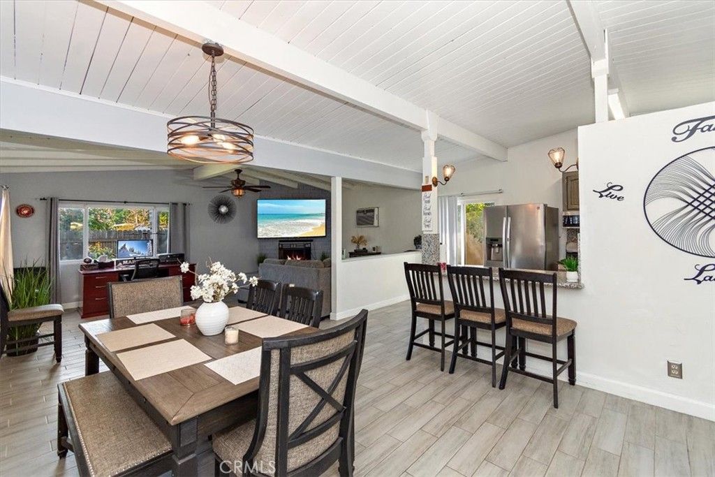 Dining room, Fireplace, Interior, Kitchen, Pendant Lights, Stainless Steel Appliances, Wood Texture Flooring