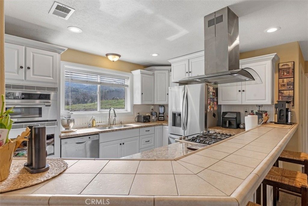 Interior, Kitchen, Recessed Lighting, Stainless Steel Appliances, Tile Countertops