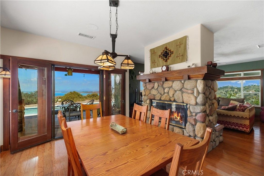 Dining room, Fireplace, Interior, Pendant Lights, Water, Wood Texture Flooring