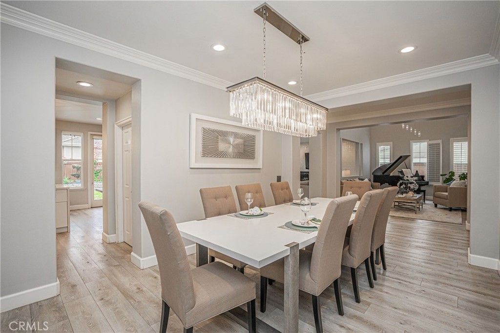 Chandelier, Dining room, Interior, Living room, Piano, Recessed Lighting, Wood Texture Flooring