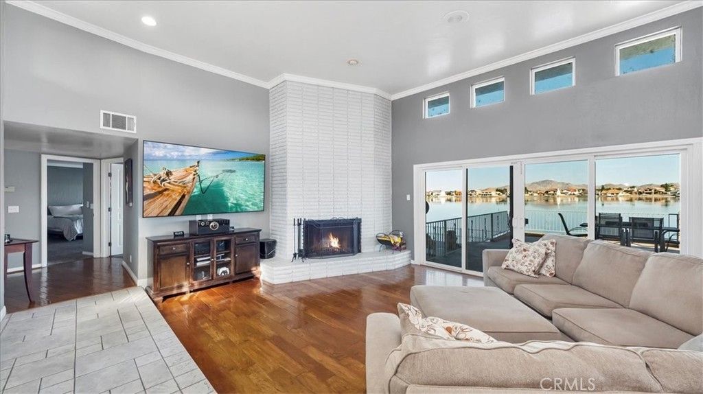 Fireplace, Interior, Living room, Recessed Lighting, Water, Wood Texture Flooring