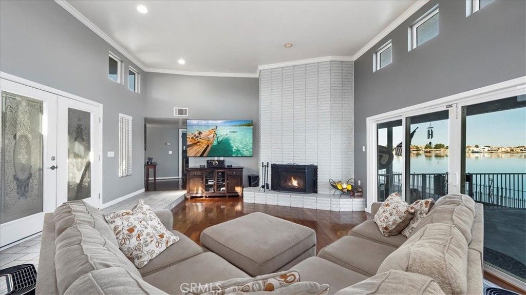 Fireplace, Interior, Living room, Recessed Lighting, Water, Wood Texture Flooring