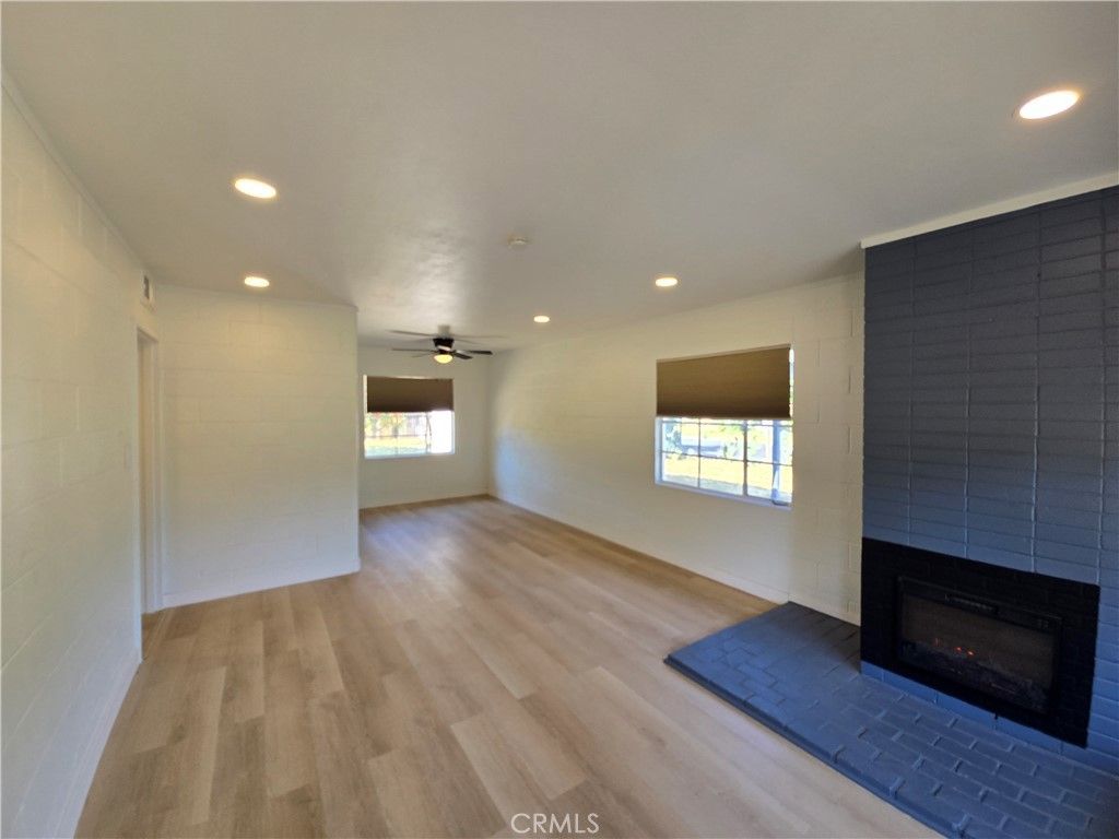 Empty room, Fireplace, Interior, Recessed Lighting, Wood Texture Flooring