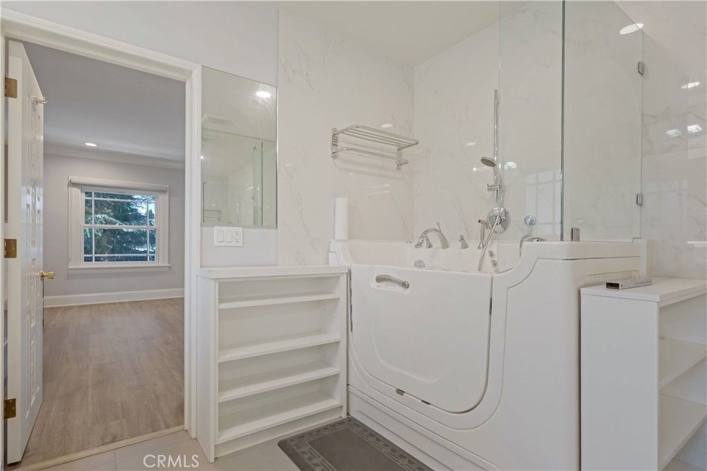 Bathroom, Interior, Marble Walls, Recessed Lighting, Washer, Wood Texture Flooring