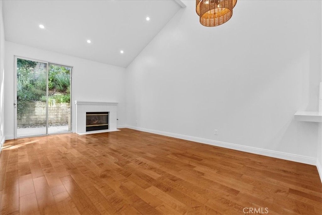 Empty room, Fireplace, Interior, Recessed Lighting, Wood Texture Flooring
