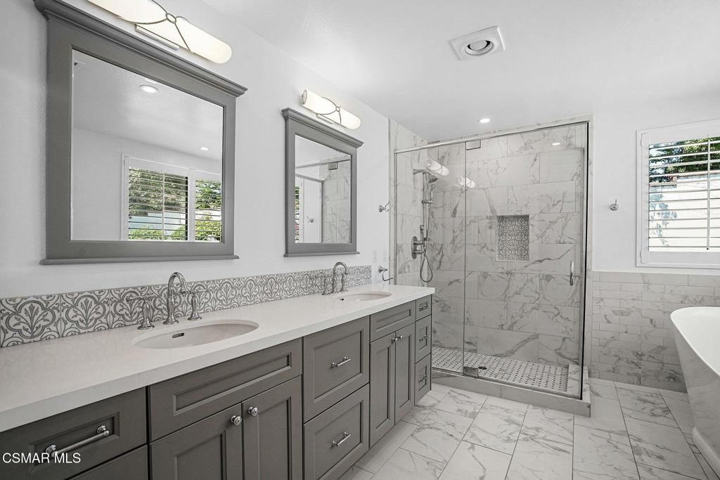 Bathroom, Dual Sink Vanities, Glass Shower, Interior, Marble, Marble Walls, Recessed Lighting