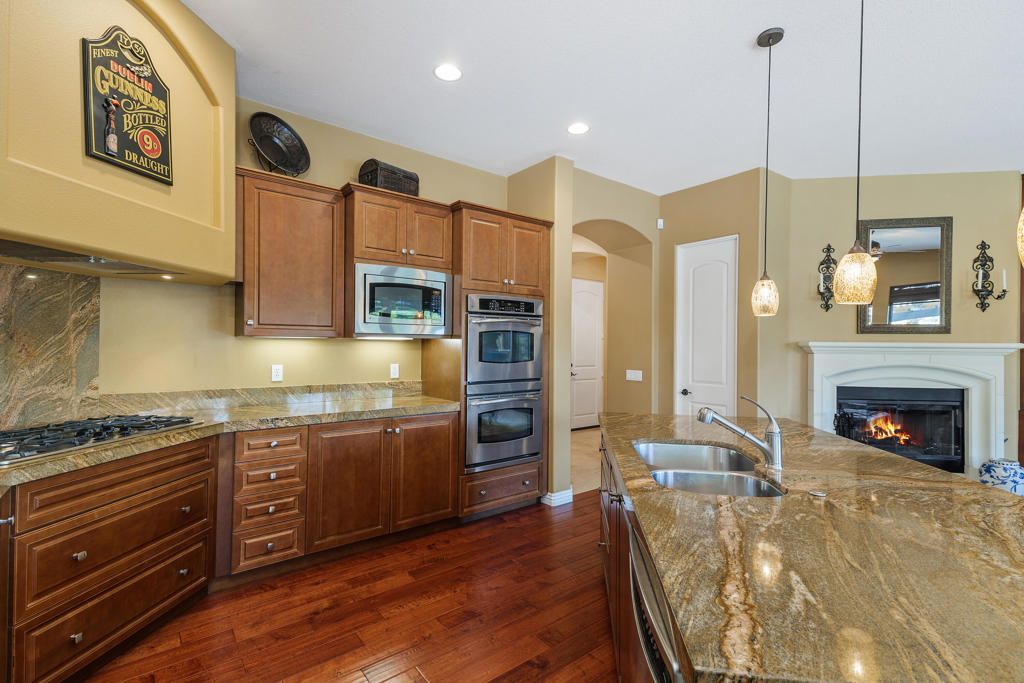 Fireplace, Interior, Kitchen, Pendant Lights, Recessed Lighting, Stainless Steel Appliances, Wood Texture Flooring