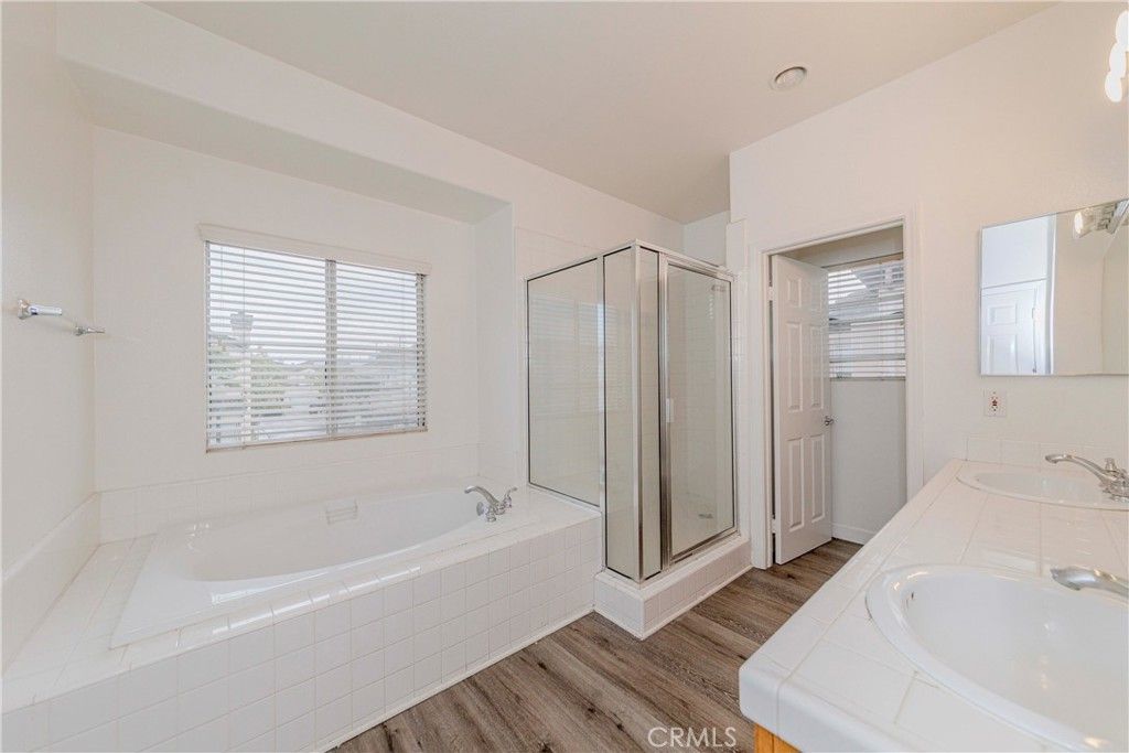 Bathroom, Dual Sink Vanities, Glass Shower, Interior, Tile Countertops, Wood Texture Flooring