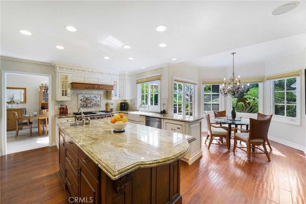 Chandelier, Dining room, Interior, Kitchen, Recessed Lighting, Stainless Steel Appliances, Wood Texture Flooring