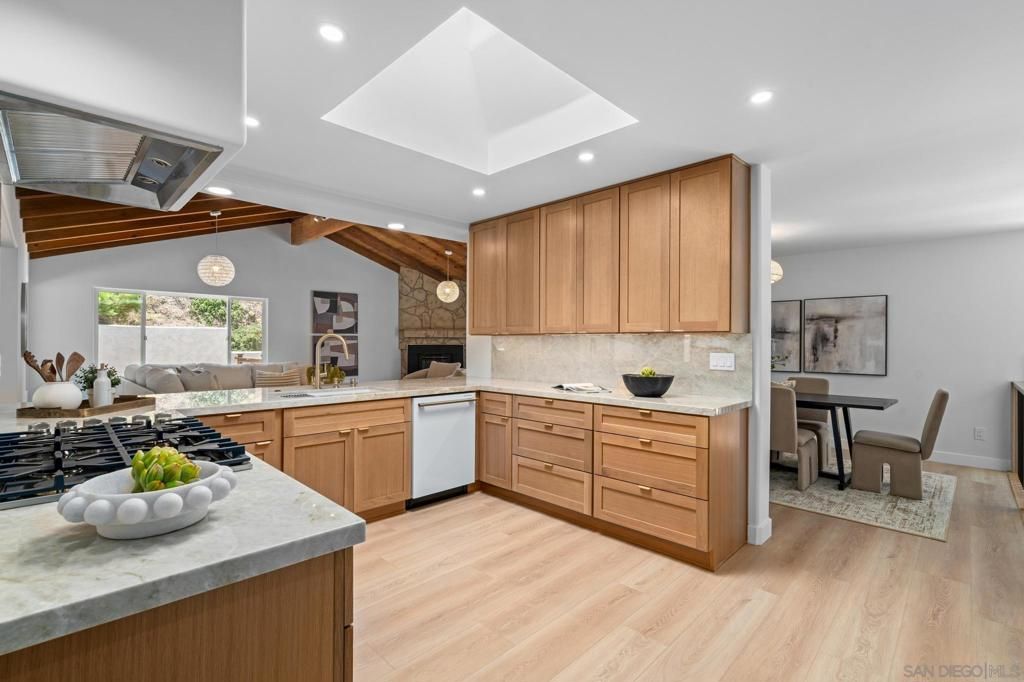 Dining room, Fireplace, Interior, Kitchen, Living room, Pendant Lights, Recessed Lighting, Stainless Steel Appliances, Wood Texture Flooring