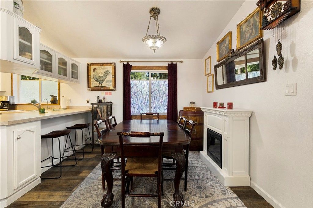 Dining room, Fireplace, Interior, Pendant Lights, Wood Texture Flooring