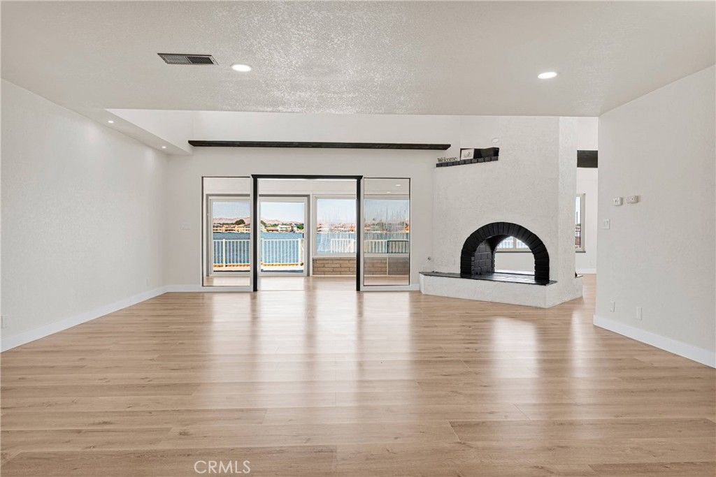 Empty room, Fireplace, Interior, Recessed Lighting, Water, Wood Texture Flooring