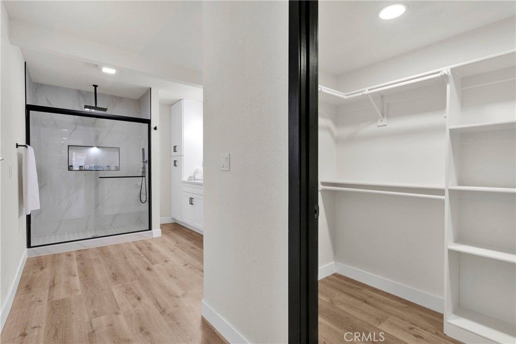Interior, Marble Walls, Recessed Lighting, Walk-in Closets, Wood Texture Flooring