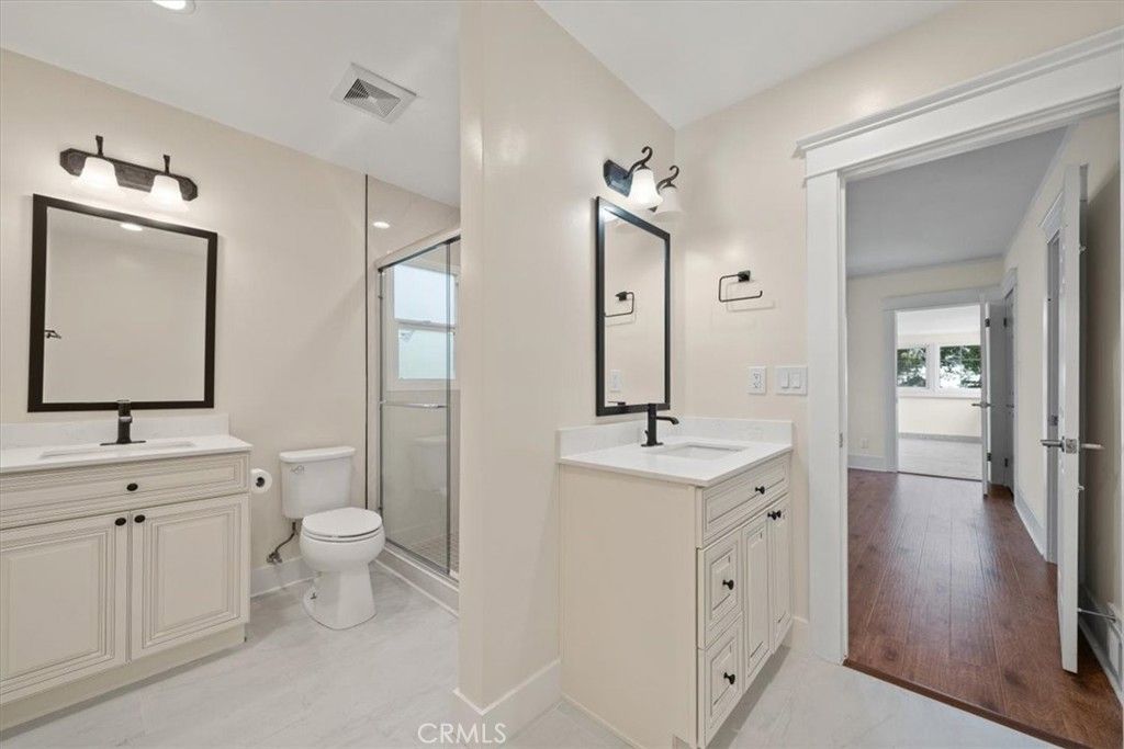 Bathroom, Dual Sink Vanities, Glass Shower, Interior, Recessed Lighting, Wood Texture Flooring