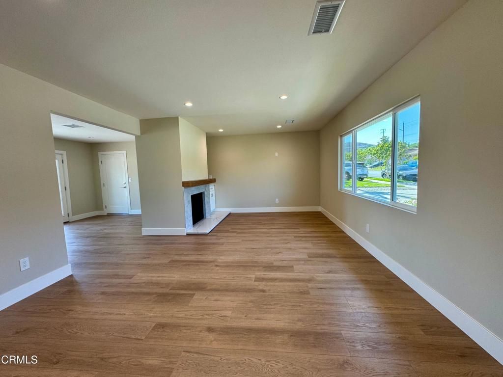 Empty room, Fireplace, Interior, Recessed Lighting, Wood Texture Flooring