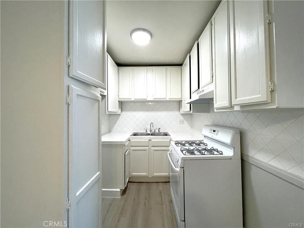 Interior, Kitchen, Tile Countertops, Wood Texture Flooring