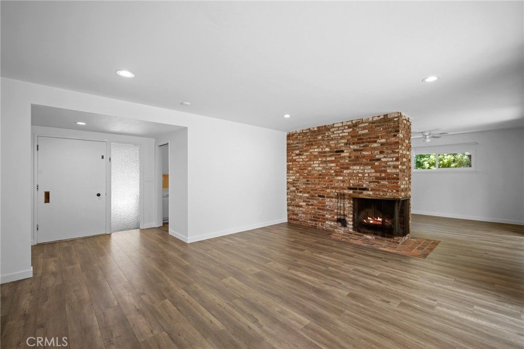 Empty room, Fireplace, Interior, Recessed Lighting, Stone Walls, Wood Texture Flooring