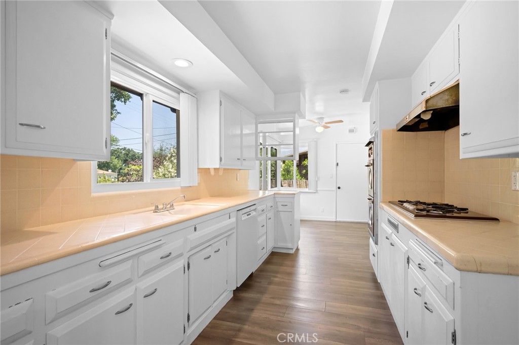 Interior, Kitchen, Recessed Lighting, Tile Countertops, Wood Texture Flooring