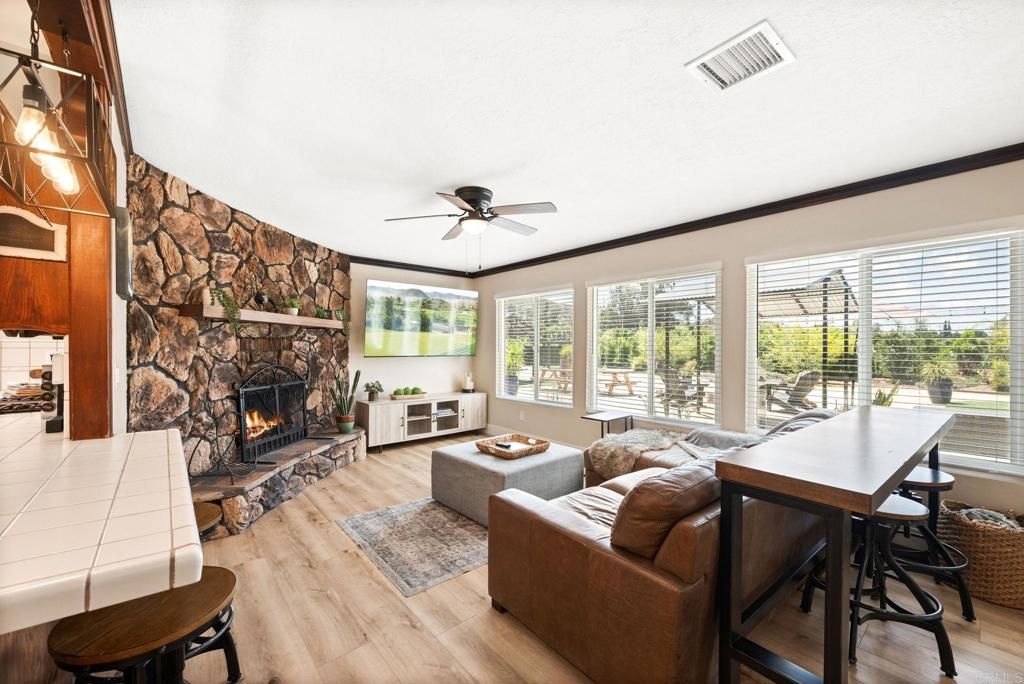 Dining room, Fireplace, Interior, Living room, Stone Walls, Wood Texture Flooring