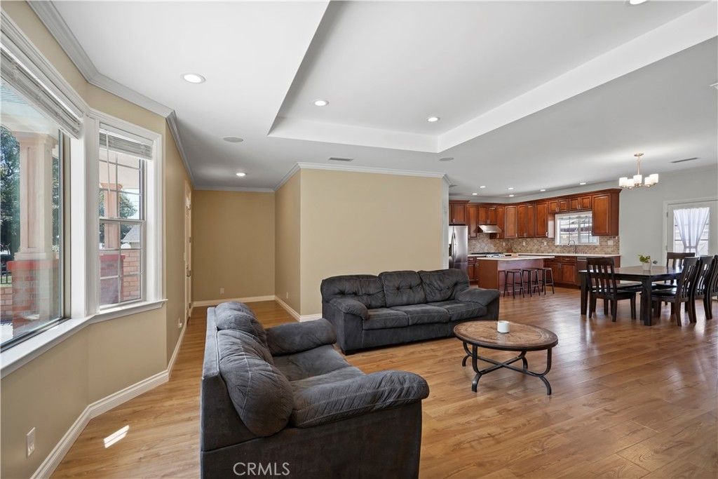 Chandelier, Dining room, Interior, Kitchen, Living room, Recessed Lighting, Stainless Steel Appliances, Wood Texture Flooring