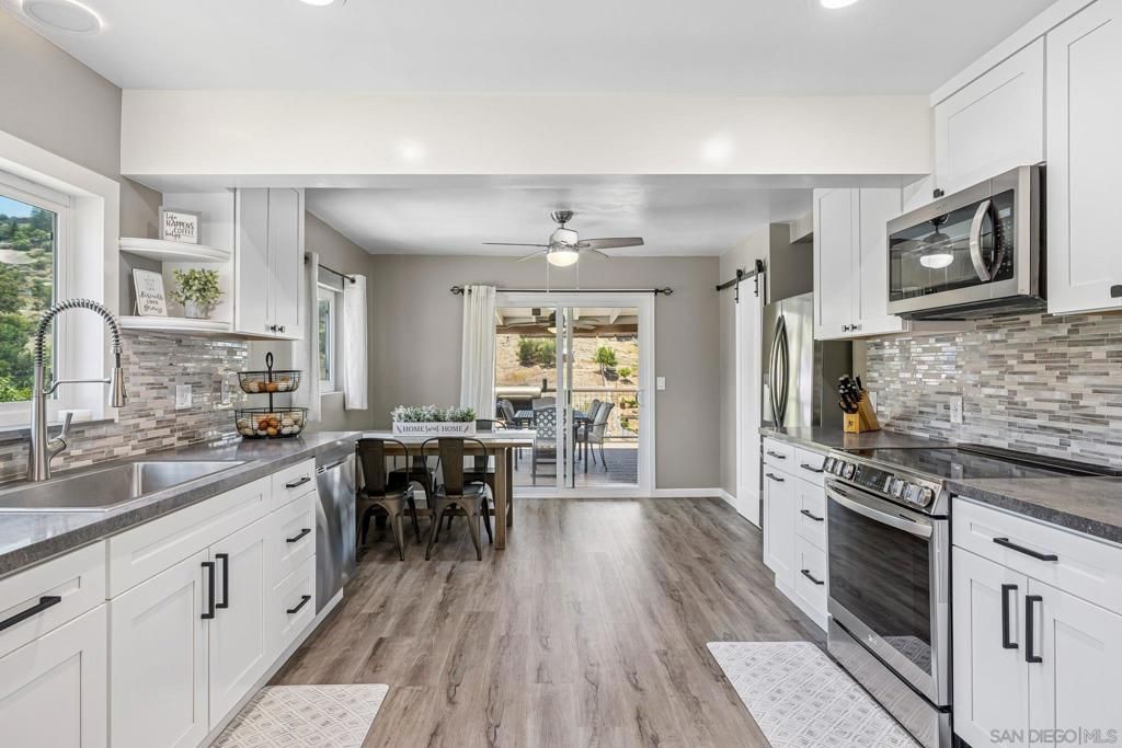 Dining room, Interior, Kitchen, Recessed Lighting, Stainless Steel Appliances, Wood Texture Flooring