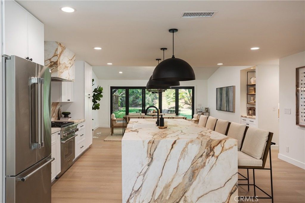 Dining room, Interior, Kitchen, Pendant Lights, Recessed Lighting, Stainless Steel Appliances, Wood Texture Flooring