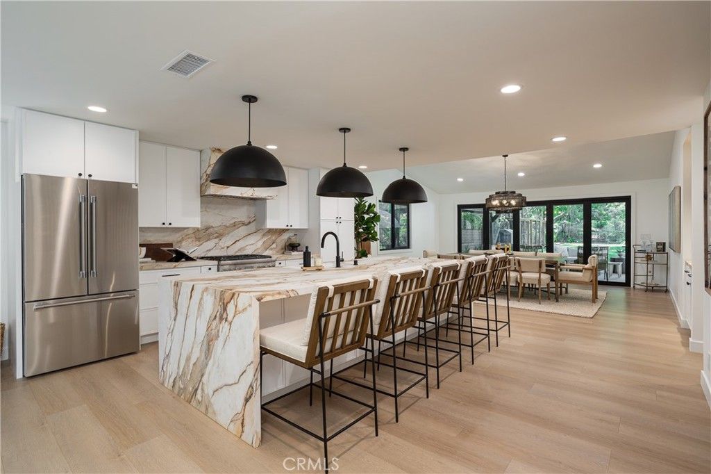 Dining room, Interior, Kitchen, Pendant Lights, Recessed Lighting, Stainless Steel Appliances, Wood Texture Flooring