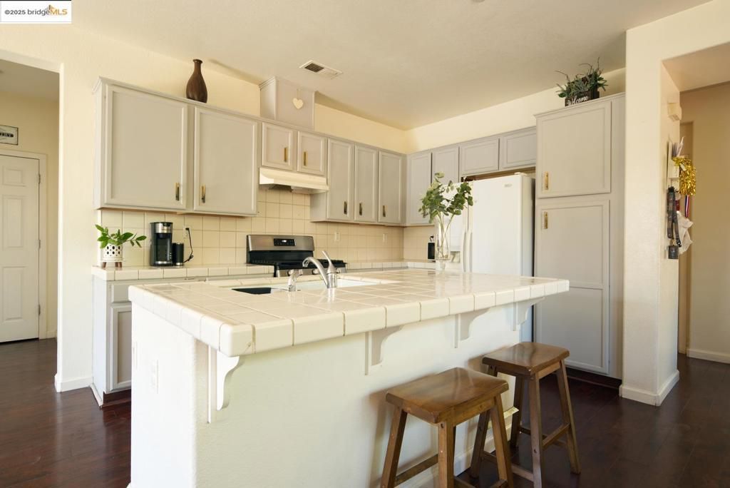Interior, Kitchen, Tile Countertops, Wood Texture Flooring