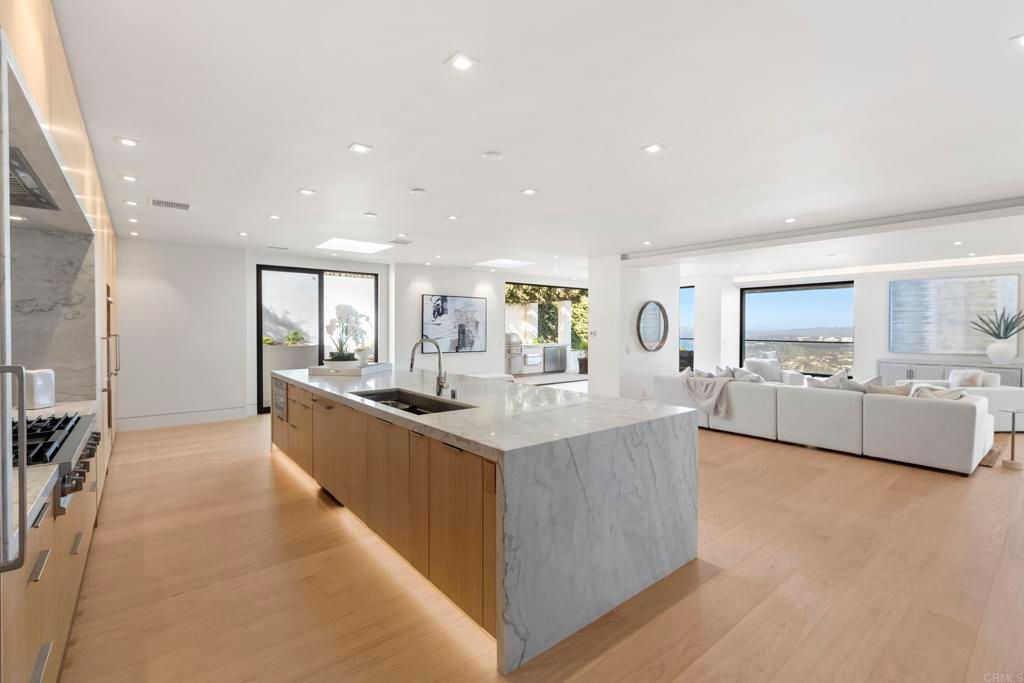 Interior, Kitchen, Living room, Marble Walls, Recessed Lighting, Stainless Steel Appliances, Water, Wood Texture Flooring