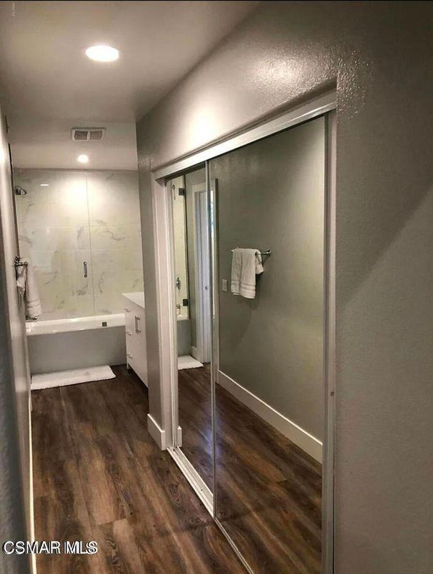 Bathroom, Glass Shower, Interior, Marble Walls, Recessed Lighting, Wood Texture Flooring