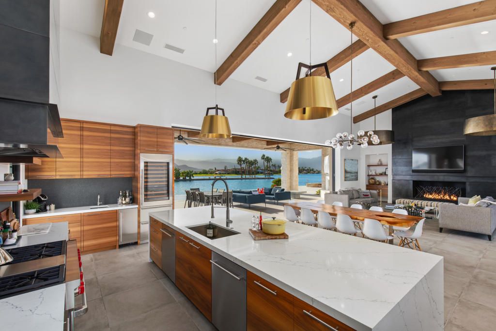 Dining room, Fireplace, Interior, Kitchen, Living room, Pendant Lights, Recessed Lighting, Stainless Steel Appliances, Water, Wooden Beams