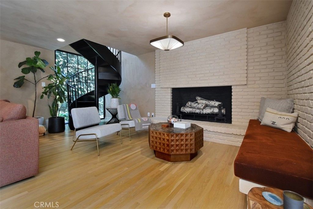Fireplace, Interior, Living room, Pendant Lights, Recessed Lighting, Stone Walls, Wood Texture Flooring
