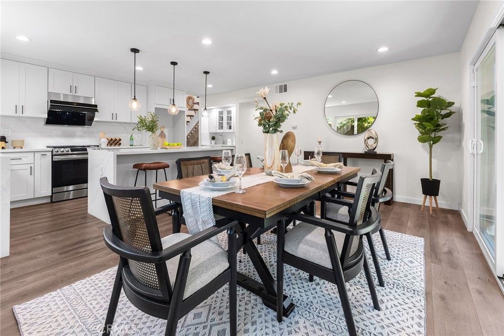 Dining room, Interior, Kitchen, Pendant Lights, Recessed Lighting, Stainless Steel Appliances, Wood Texture Flooring