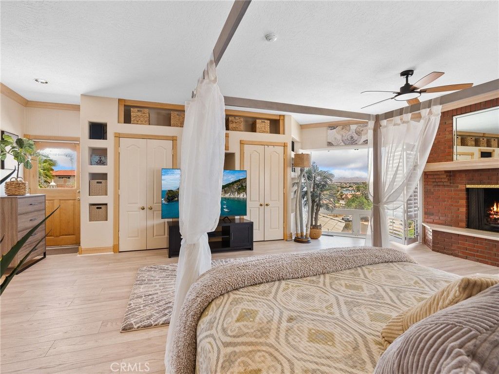Bedroom, Fireplace, Interior, Recessed Lighting, Stone Walls, Wood Texture Flooring