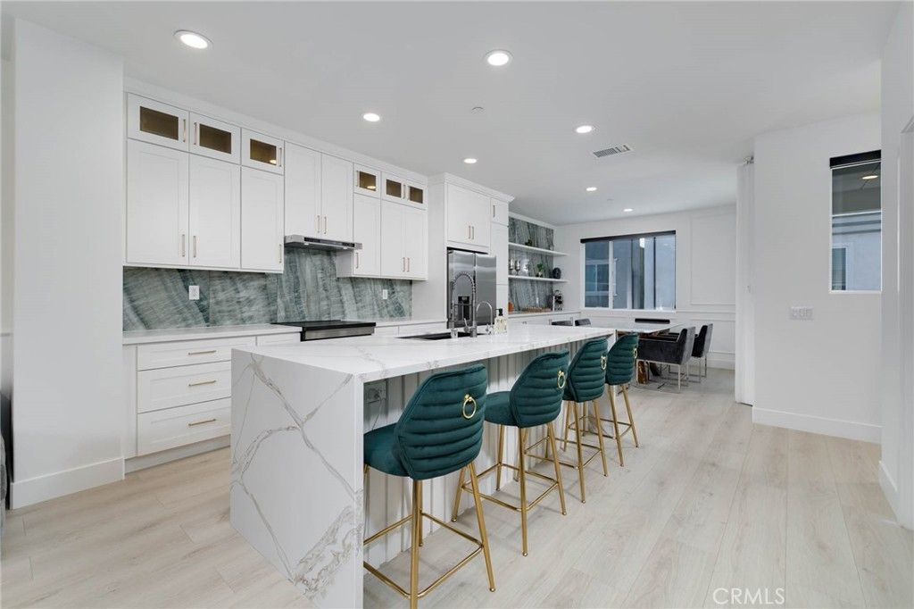 Interior, Kitchen, Marble Walls, Recessed Lighting, Stainless Steel Appliances, Wood Texture Flooring