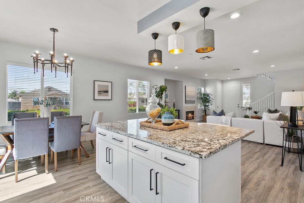 Dining room, Fireplace, Interior, Living room, Pendant Lights, Recessed Lighting, Wood Texture Flooring