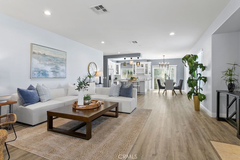 Chandelier, Dining room, Interior, Kitchen, Living room, Pendant Lights, Recessed Lighting, Stainless Steel Appliances, Wood Texture Flooring