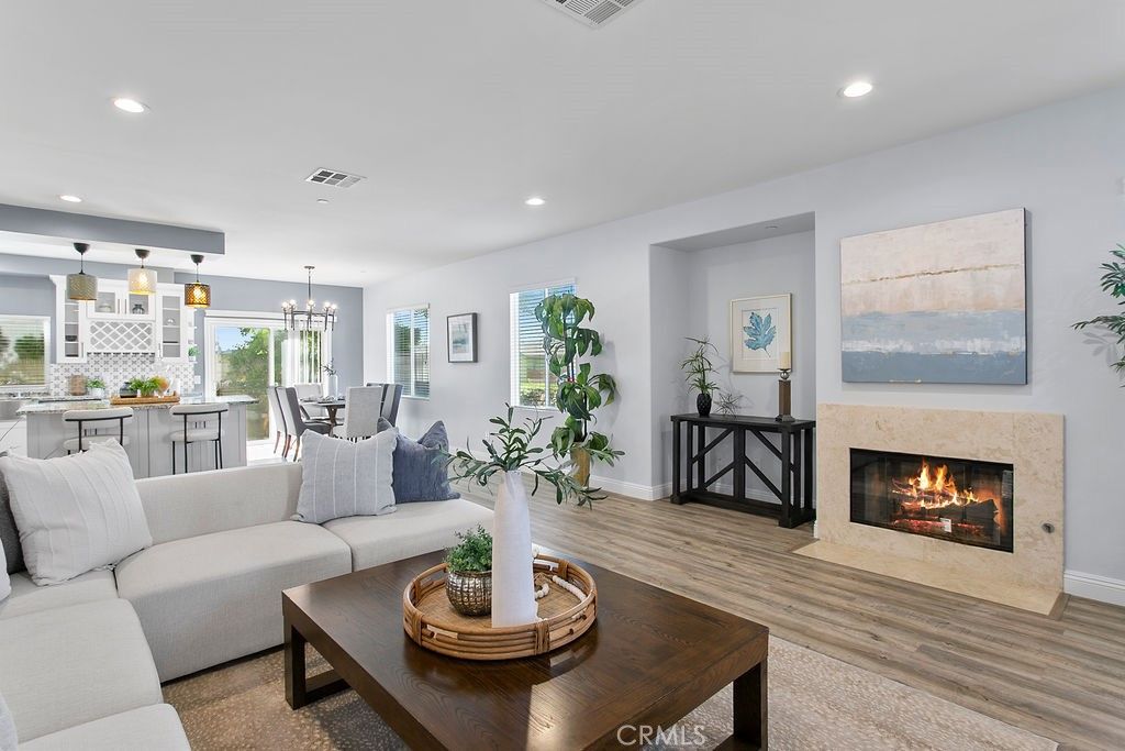 Dining room, Fireplace, Interior, Living room, Pendant Lights, Recessed Lighting, Wood Texture Flooring