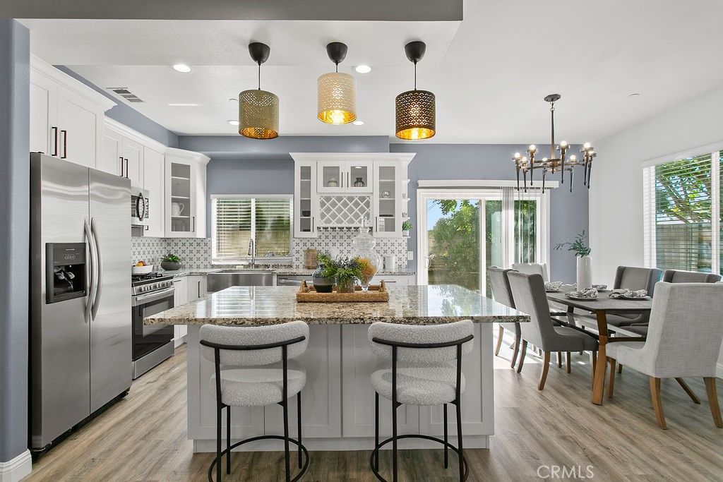 Dining room, Interior, Kitchen, Pendant Lights, Recessed Lighting, Stainless Steel Appliances, Wood Texture Flooring