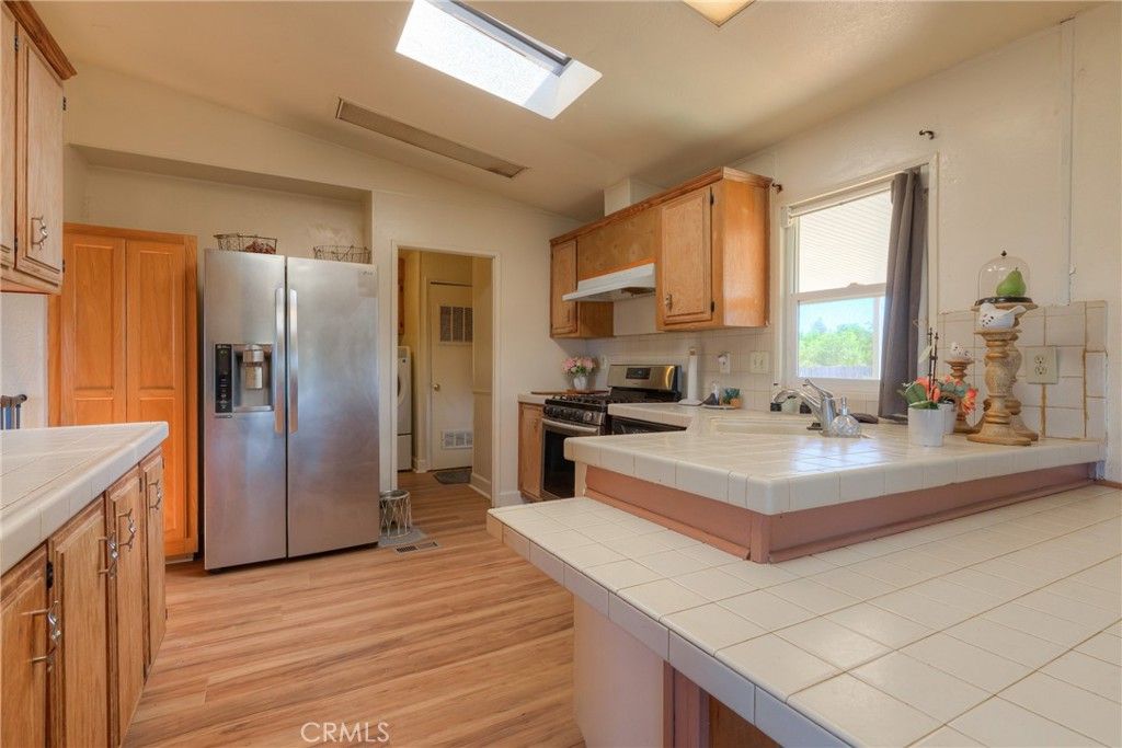 Interior, Kitchen, Stainless Steel Appliances, Tile Countertops, Wood Texture Flooring