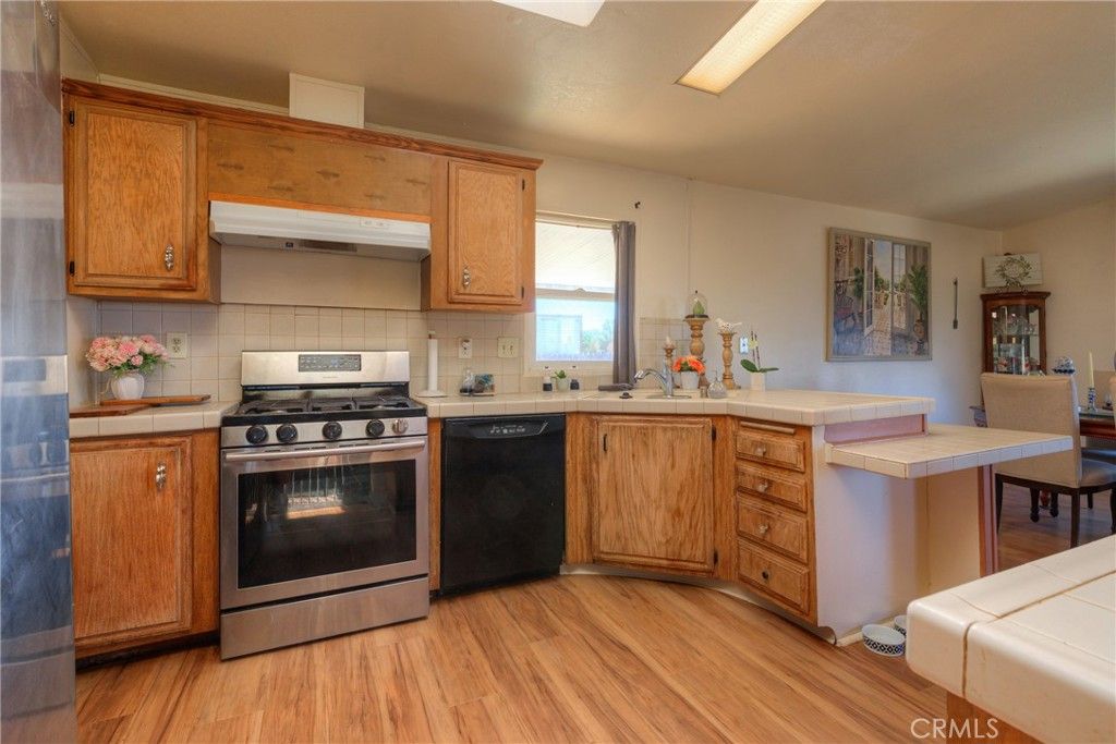 Interior, Kitchen, Stainless Steel Appliances, Tile Countertops, Wood Texture Flooring