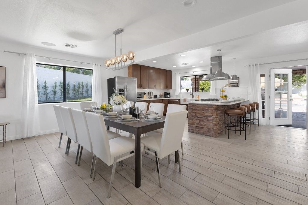 Dining room, Interior, Kitchen, Pendant Lights, Recessed Lighting, Stainless Steel Appliances, Wood Texture Flooring