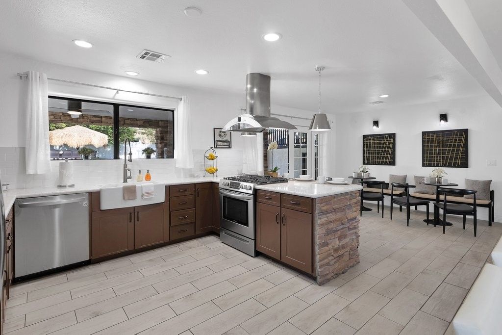 Dining room, Interior, Kitchen, Pendant Lights, Recessed Lighting, Stainless Steel Appliances, Wood Texture Flooring