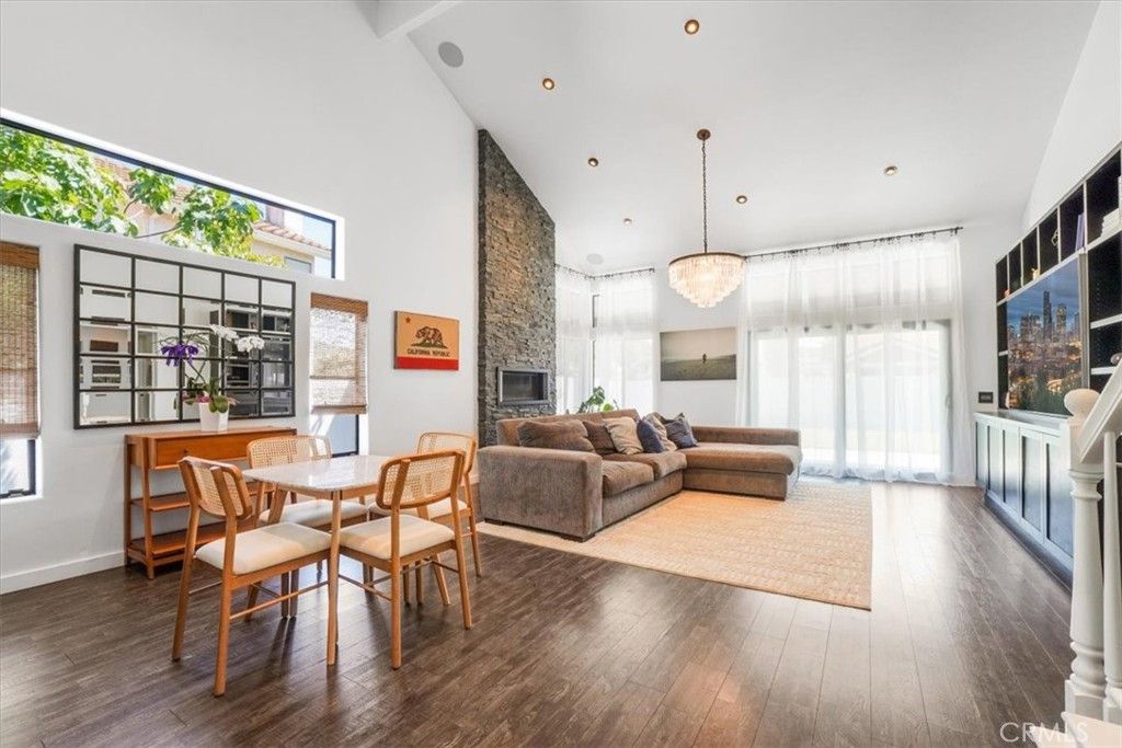 Chandelier, Dining room, Fireplace, Interior, Living room, Recessed Lighting, Wood Texture Flooring