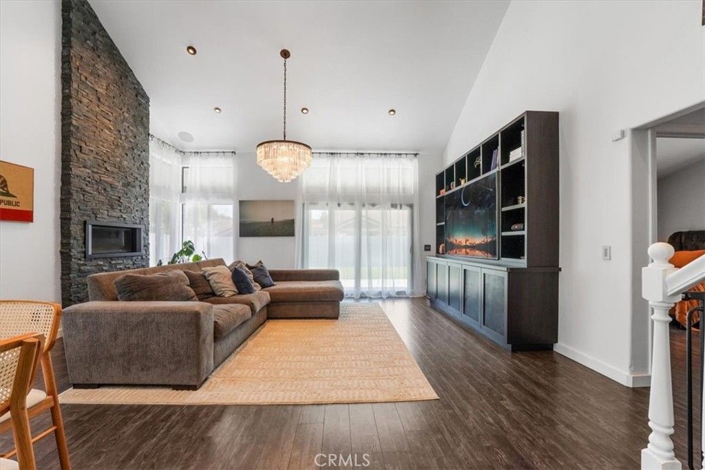 Chandelier, Fireplace, Interior, Living room, Recessed Lighting, Wood Texture Flooring