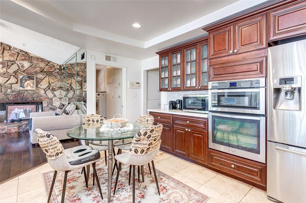 Dining room, Fireplace, Interior, Kitchen, Living room, Recessed Lighting, Stone Walls, Wood Texture Flooring