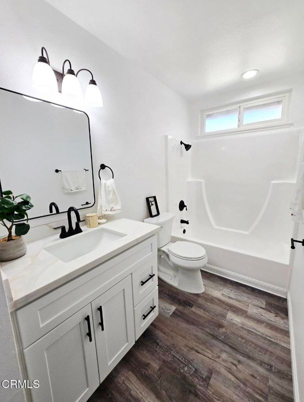 Bathroom, Dual Sink Vanities, Interior, Recessed Lighting, Wood Texture Flooring