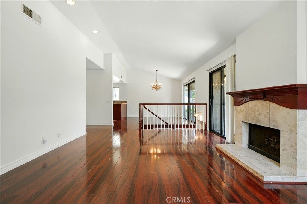 Chandelier, Empty room, Fireplace, Interior, Recessed Lighting, Wood Texture Flooring
